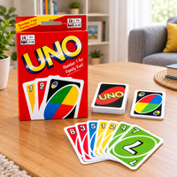 UNO card game set with red deck box and colorful cards spread on table